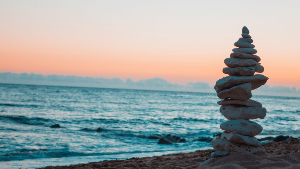 peaceful beach with balancing rocks